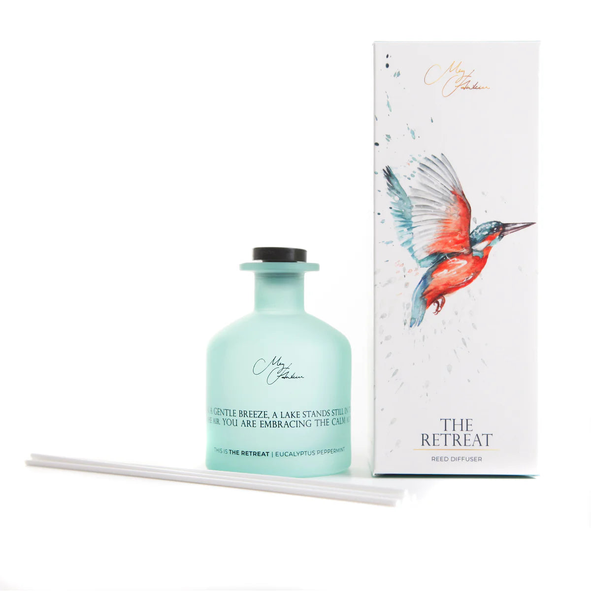 Mint green diffuser bottle with packaging featuring a bird illustration on a white background