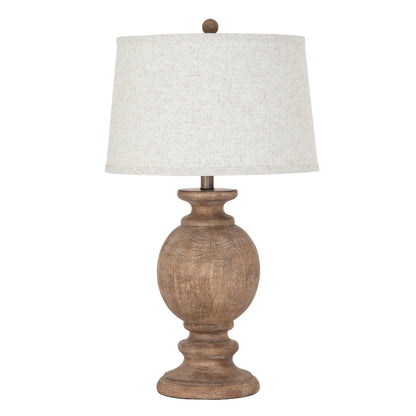 Table lamp with wooden base and white shade on a white background