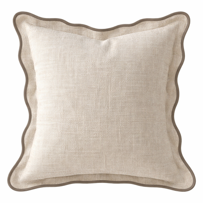 Beige pillow with scalloped edge on a white background